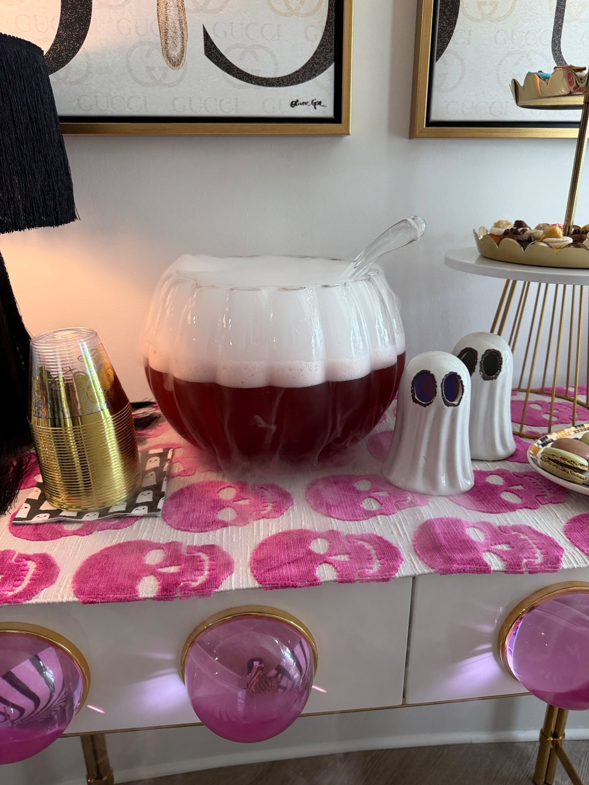 The Galloween punch bowl up close, fog rolling over the console with ceramic ghosts and gold cups