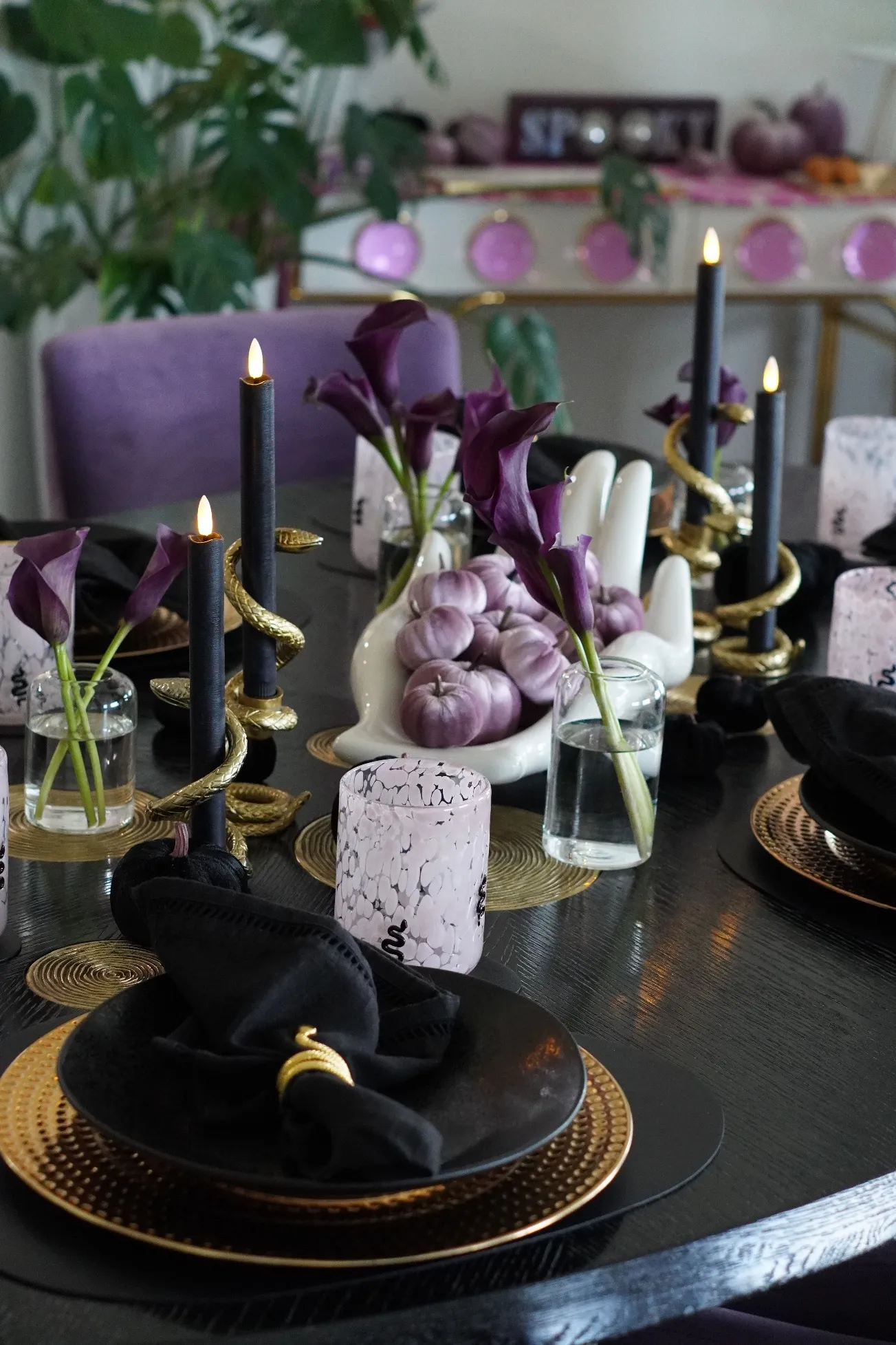 Galloween tablescape in lilac, purple, black and gold with the SPOOKY sign behind the table